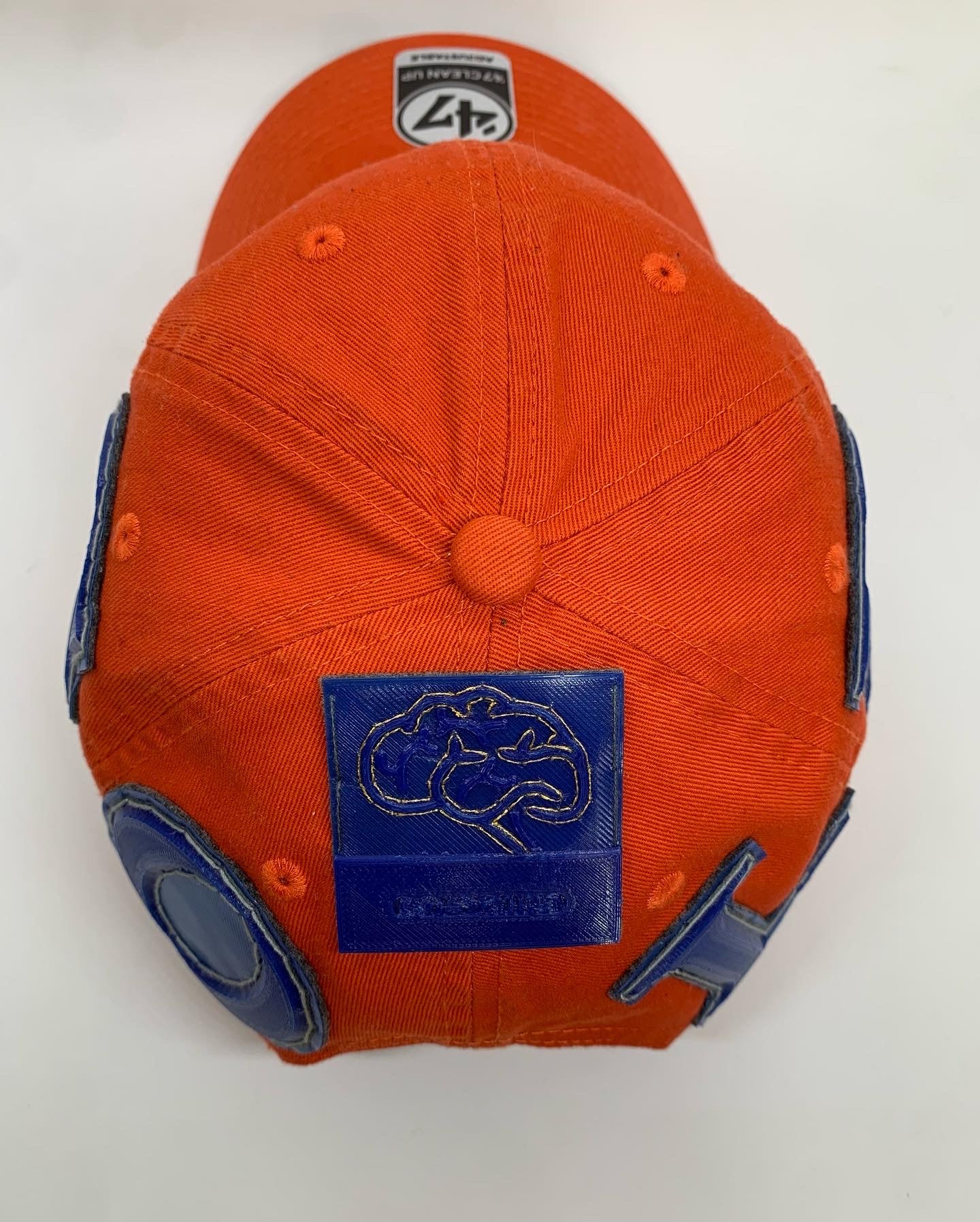 Front in the Back GOLD dad hat in orange and blue