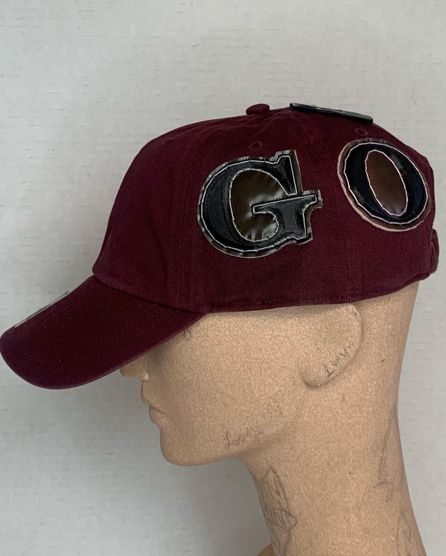 Front in the Back Gold hat in Burgandy