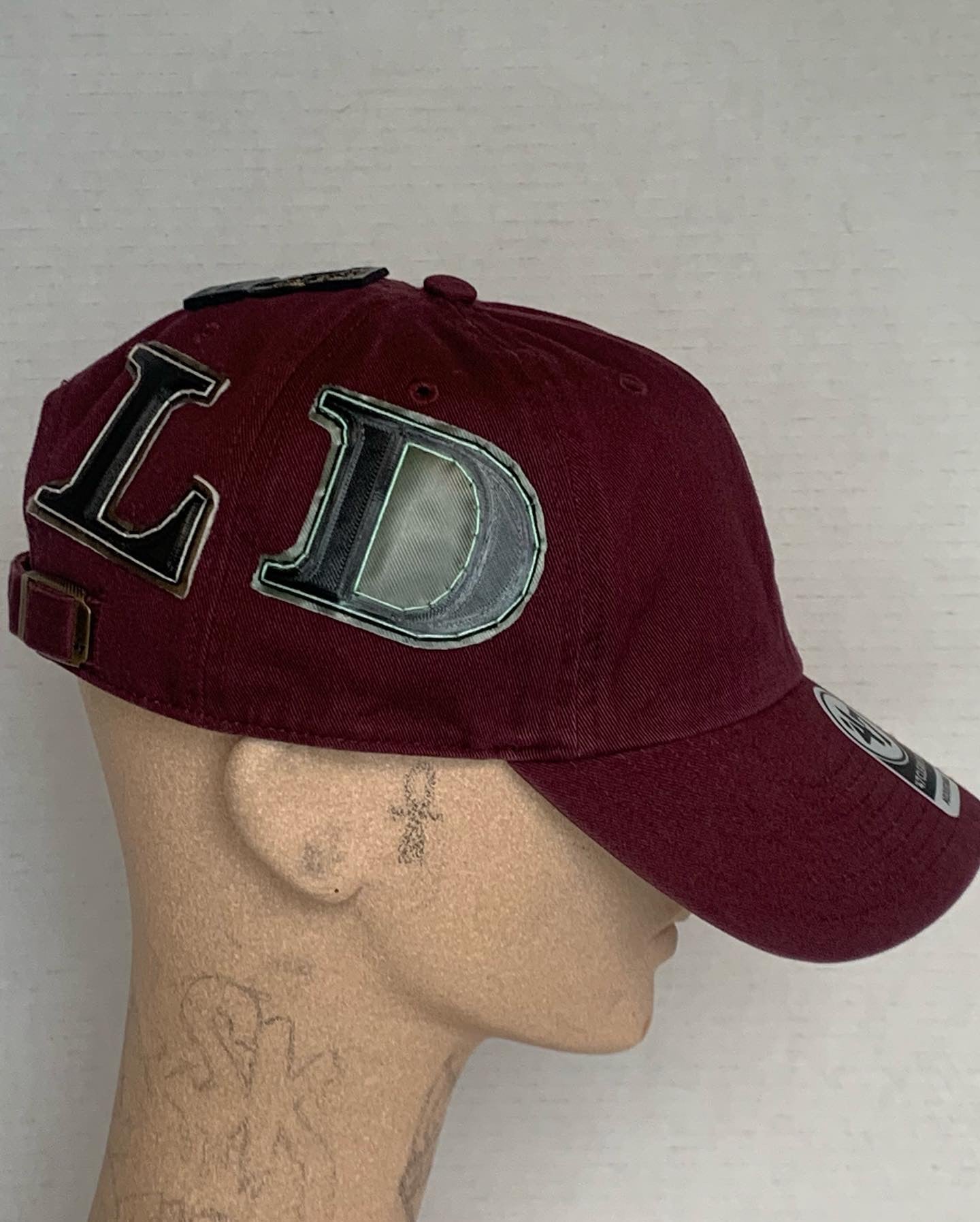 Front in the Back Gold hat in Burgandy